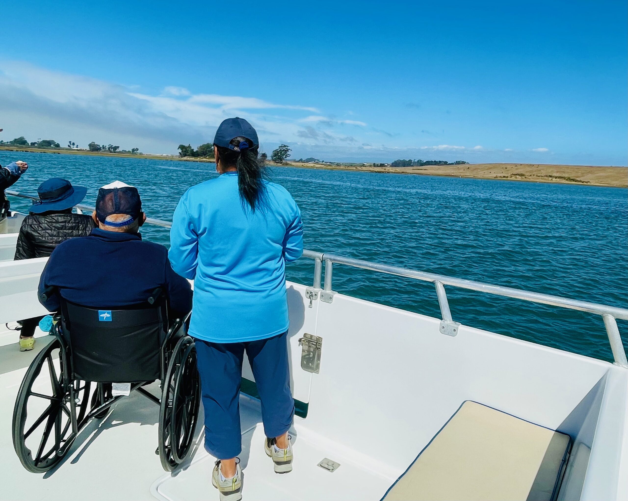 A woman and her father enjoy the Elkhorn Slough aboard the fully wheelchair accessible El Cat